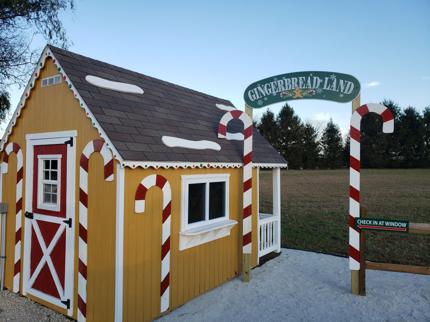 Gingerbread Land cottage with candy-cane posts