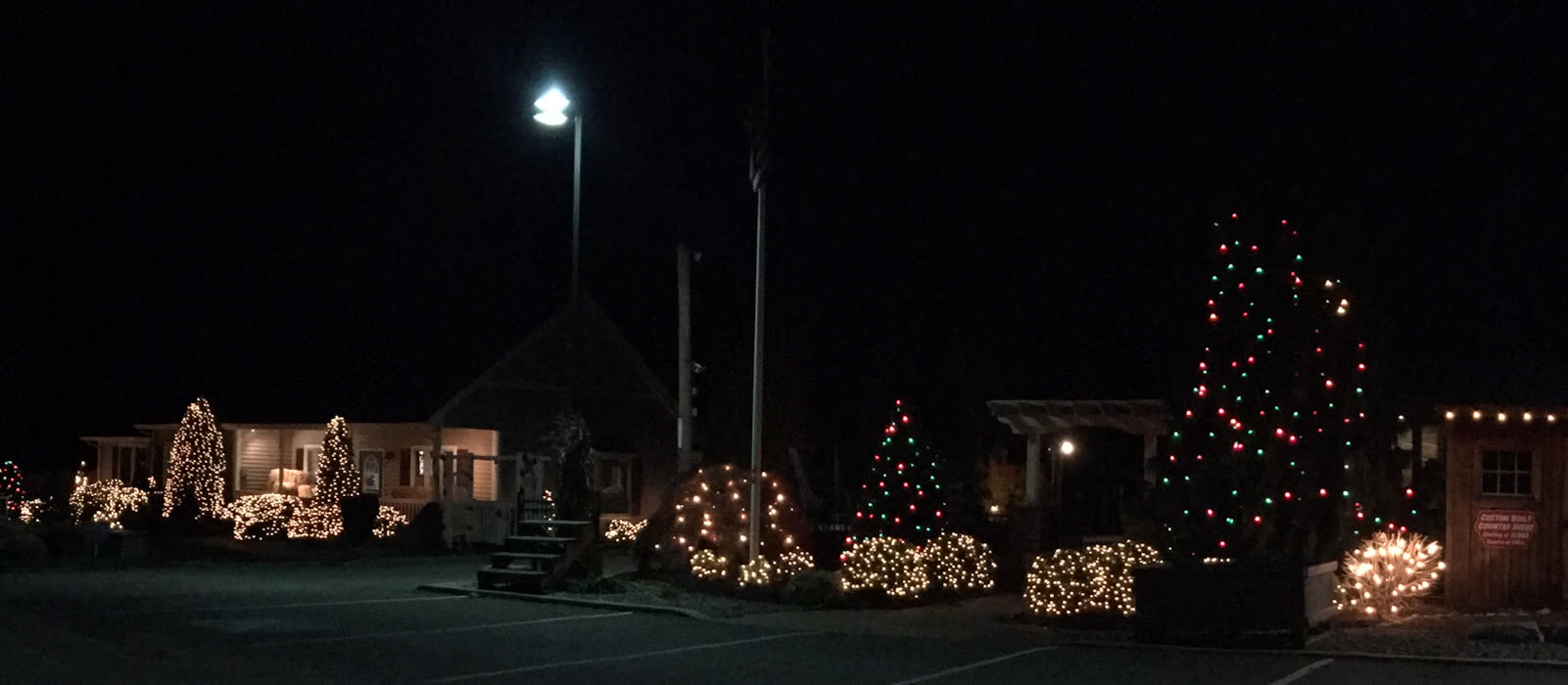 The farm lit up with Christmas lights at night