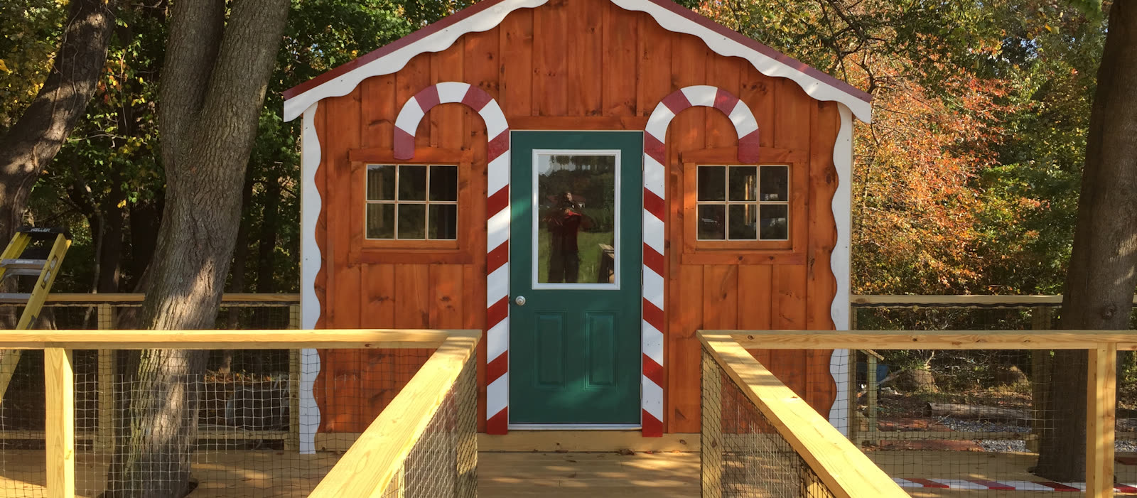A candy-cane trimmed holiday cottage at the farm