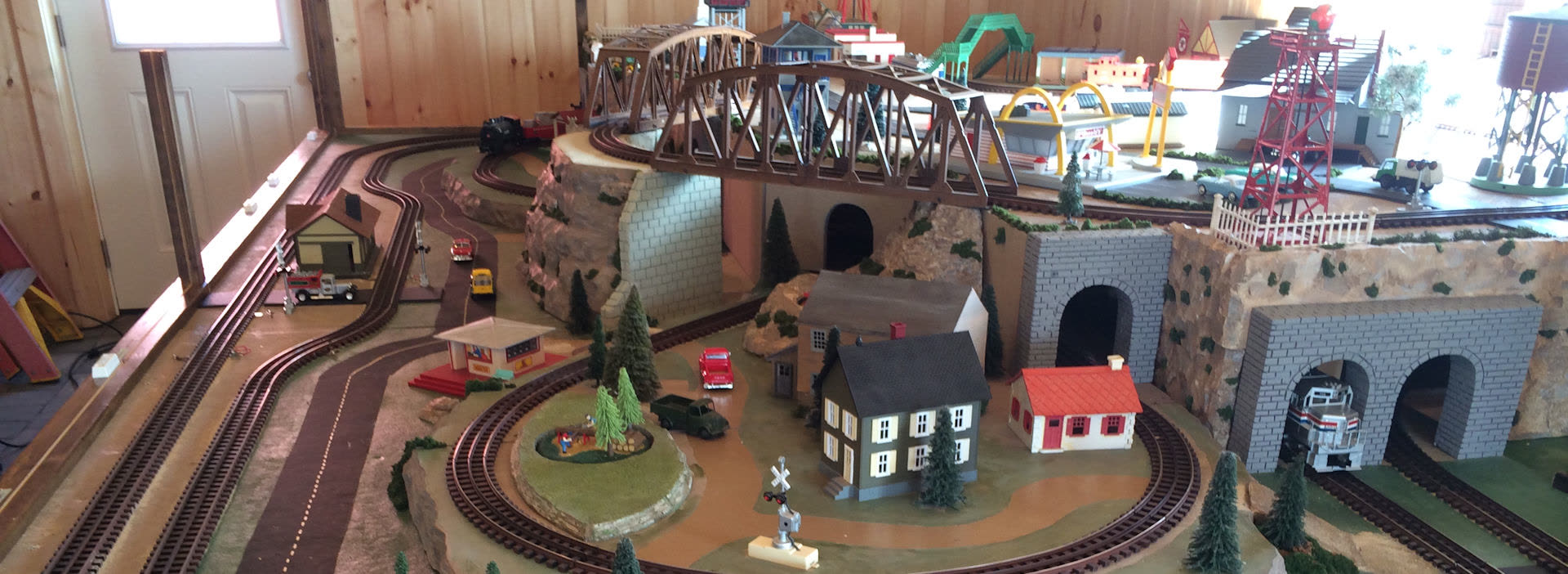 The large indoor model train display with bridges and tunnels